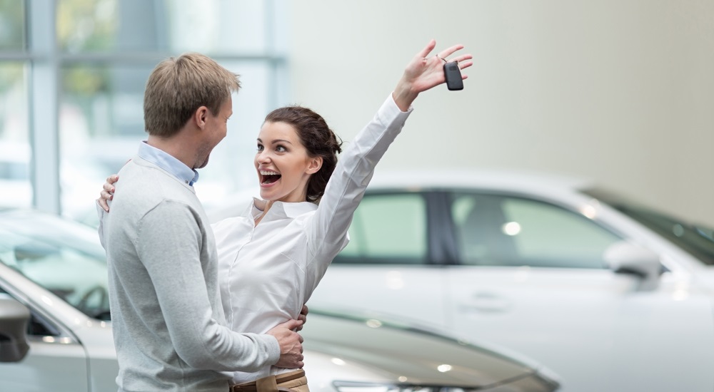 Embracing,Couple,With,Car,Keys